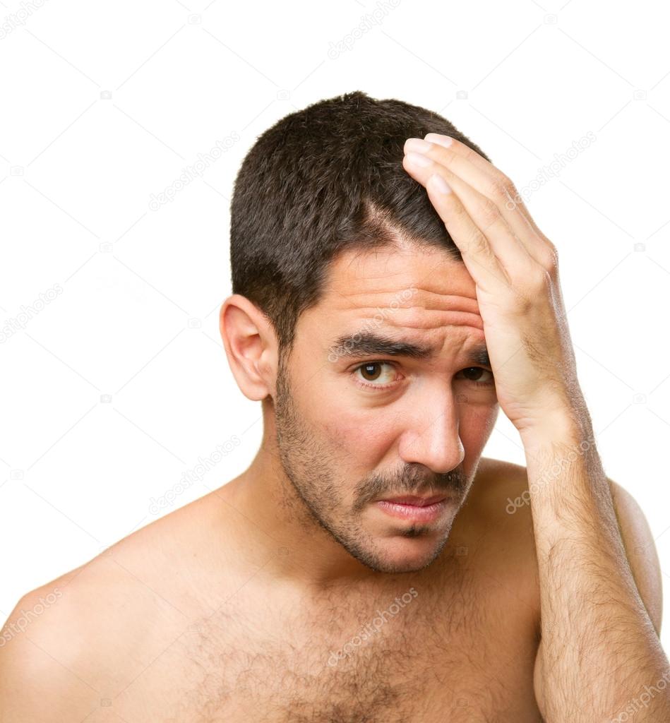 Young man concerned about hair loss  Stock Photo © agongallud #71912003
